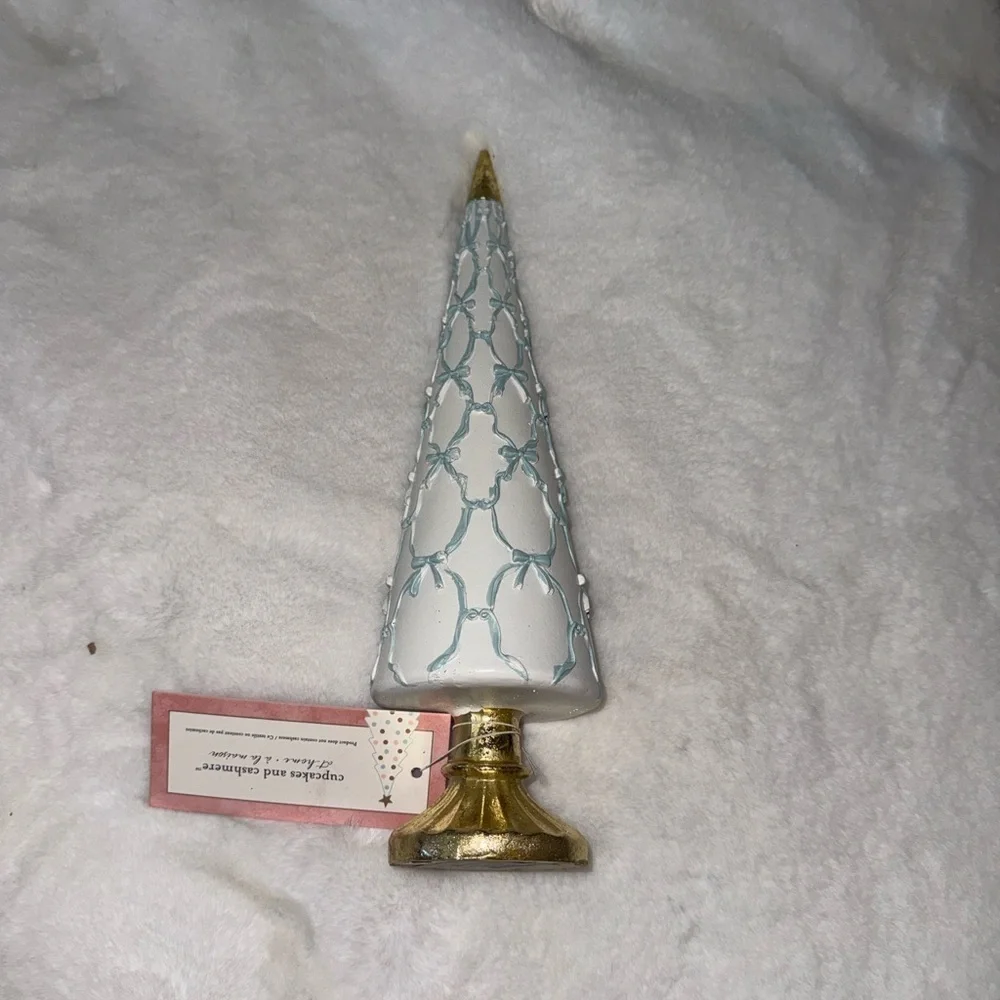 Cupcakes and cashmere Christmas Tree w blue bows across white cone & gold base
